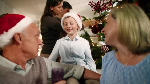 Family Decorating Christmas Tree at Home