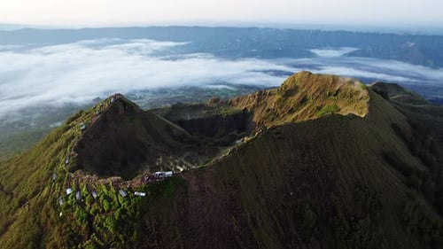 Mount Batur close aerial orbit at dawn