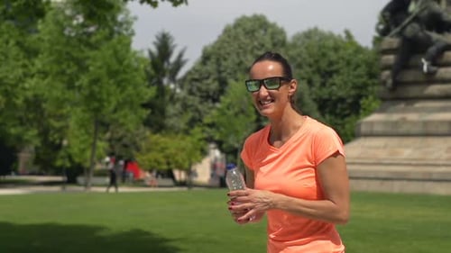 Sportive Couple Resting After Running in City Park, Super 240