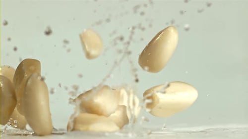 Garlic Falls on a Light Table with Splashes Filmed on a Highspeed Camera at 1000 Fps