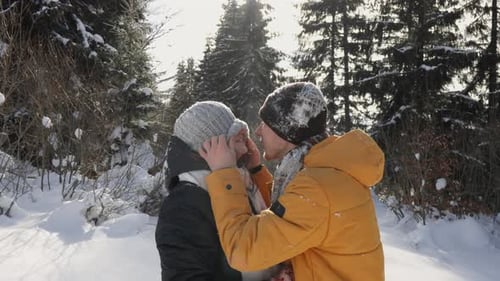 Joyful Touches Kisses and Casual Smiles of a Man and a Woman Add a Special Touch to Their Winter