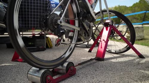 Cyclist Pedaling on a Stationary Bicycle Outdoors