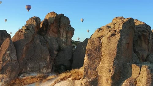 Aerial view of hot air balloon flying over Cappadocia at summer sunrise. Turkey. 4K
