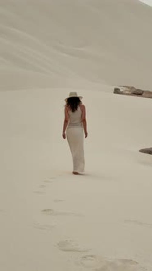 Young Adult Woman Walking in Desert Landscape