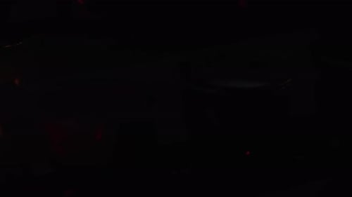 Glowing Votive Candles Flickering in the Dark