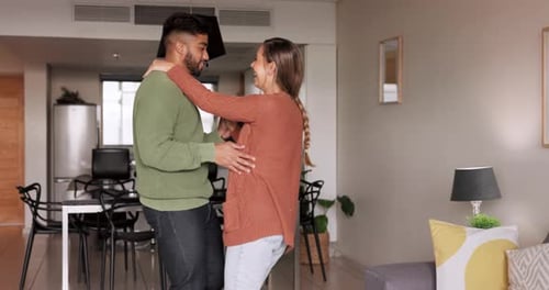 Couple Dancing Together in Modern Apartment
