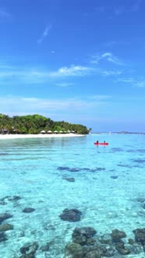 Aerial View Tropical Maldives Island Surrounded By Turquoise Sea Bright Daylight and Lush Greenery