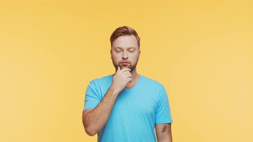 Thinking Young Man Over Vibrant Background Studio Portrait of Expressive Handsome Person