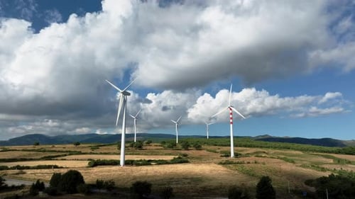 Wind Power Plant Electric Generator Spinning in the Mountains