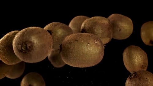 Kiwi Fruit Floating on a Black Background