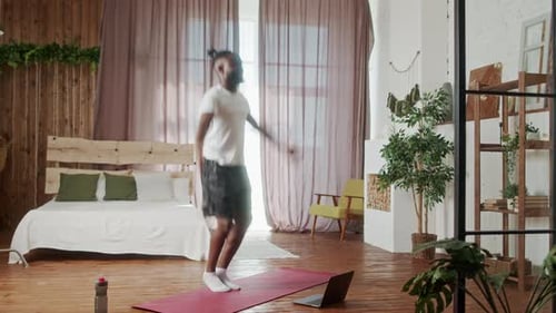 Man Exercising on Yoga Mat Indoors