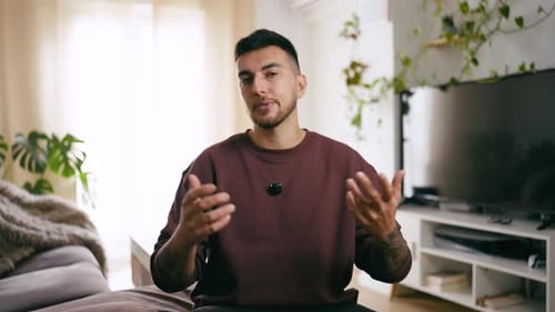 Young Man Talking to Camera in Home Setting
