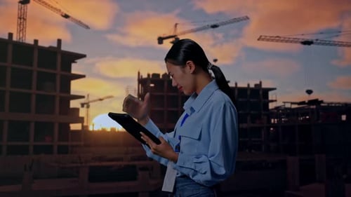 Asian Female Professional Worker Use Tablet And Headache At Building Site