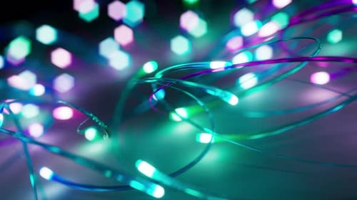 3D-Animation von mehrfarbigen leuchtenden Neonlinien, die sich im Raum bewegen