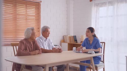 Home Healthcare Provider Consults Senior Couple