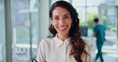 Mature, woman face and doctor pride in hospital, healthcare professional and cardiology specialist