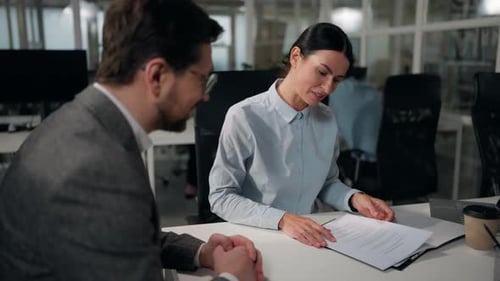 Two Business People Colleagues in Office Discuss Papers Caucasian Businesswoman Insurance Agent Loan