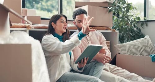 Couple, new house and point on floor with tablet at property, smile or online shopping
