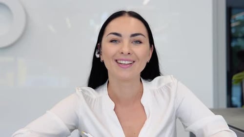 Woman Talking on Video Call in Modern Office