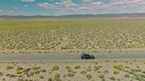 Car driving along road on American road trip with beautiful smooth