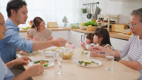 Extended Family Enjoys a Meal Together at Home