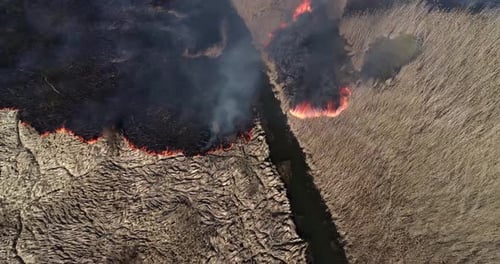 Aerial footage of a massive blaze burning through a dry field