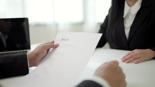 Job Interview Success Handing over your professional resume to the interviewer