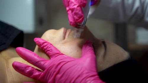 Woman Receives Facial Treatment in Beauty Clinic