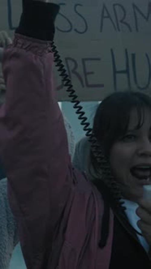 Group of People Protesting with Megaphone and Signs