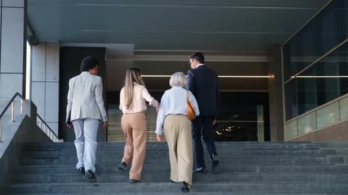 Business People Walking Up Stairs