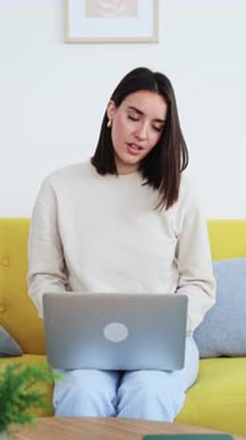 Woman Stretching Neck While Working From Home