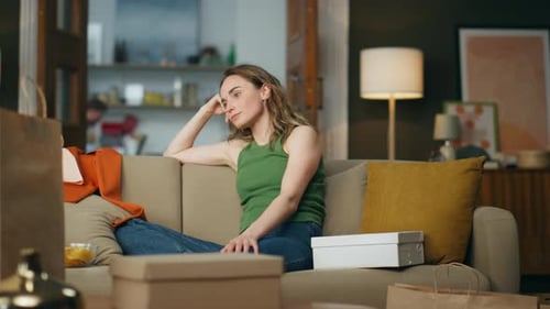 Nervous Lady Sitting Sofa Waiting Parcel at Home Stressed Woman Tapping Fingers