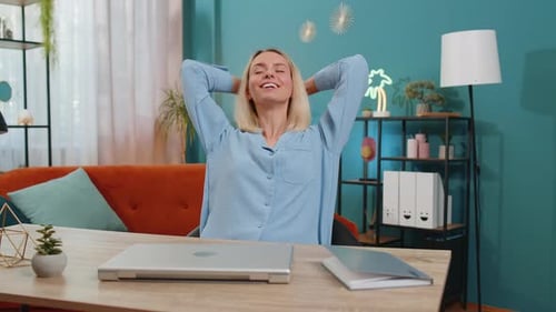 Woman Finishes Work and Relaxes at Home