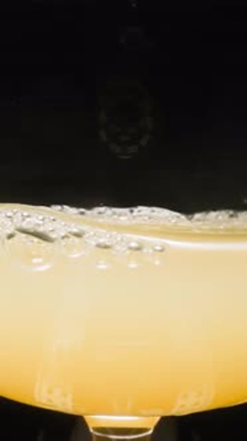 Close Up of Bubbles in Light Orange Liquid