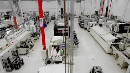 Modern at vehicle tech manufacturing plant, wide pan