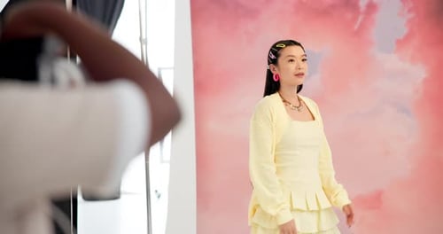 Studio, fashion model and woman with smile, photoshoot and photographer with camera