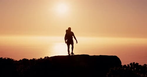 Person, silhouette and hiking on mountain at sunset with ocean, sky and mockup space on vacation