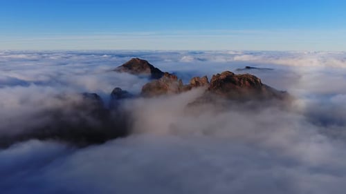 Aerial Madeira Highlands Peaks Rise Above Moving Cloud Inversion