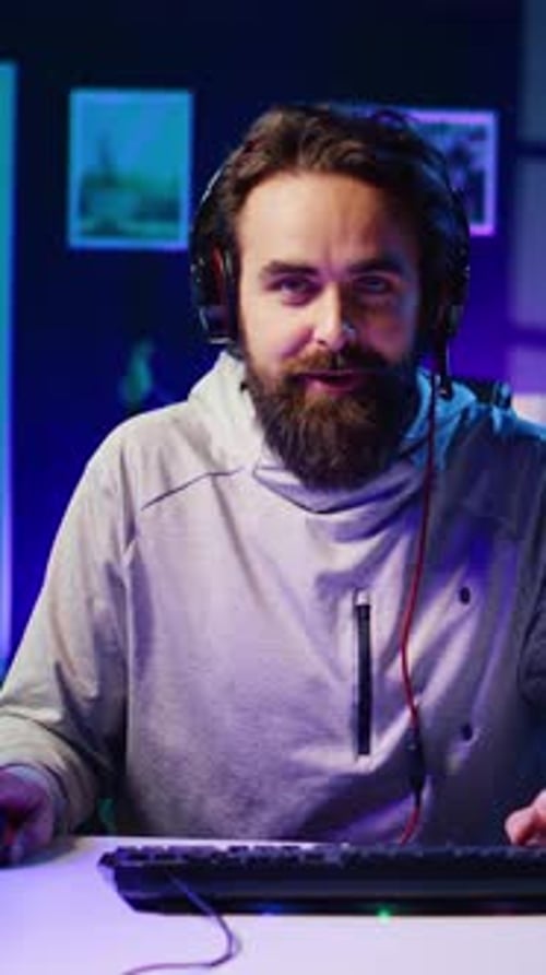 Man with Beard Using Computer at Night