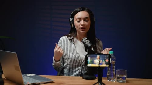 Young Woman Recording Podcast on Phone