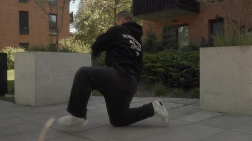 A street dancer performs dynamic freestyle, blending various street dance styles