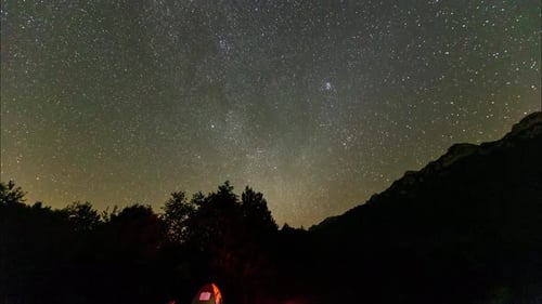 Night to day time-lapse camping in the jungle enjoy travel to forest national park in Iran mountain