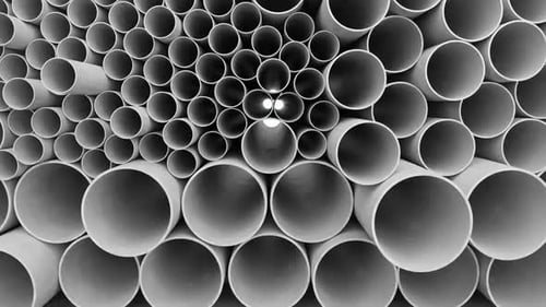 Abstract monochrome pattern of multiple PVC pipes tubes and cylinders arranged