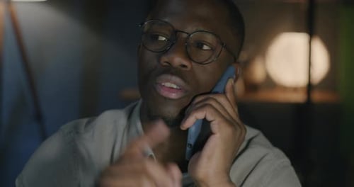 Man Talking on Cell Phone at Night