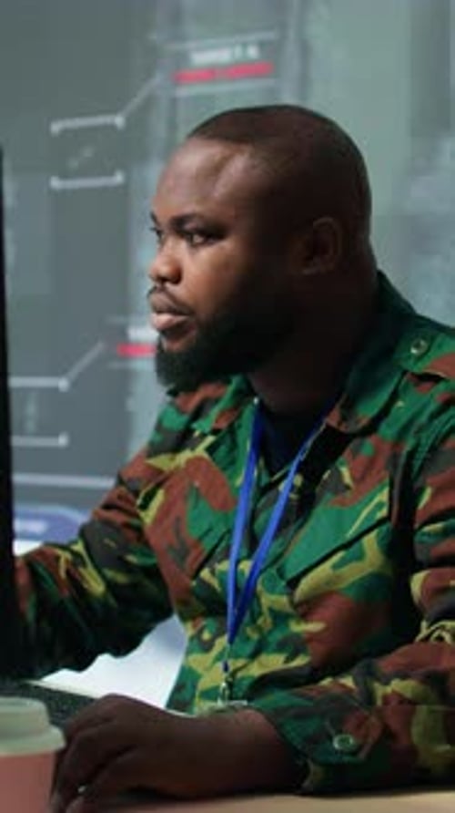 Vertical Video Army Professionals in Command Post Oversee Satellite and Real Time Surveillance