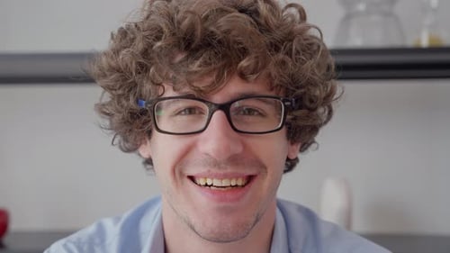 Happy Young Man Smiling Indoors Close Up