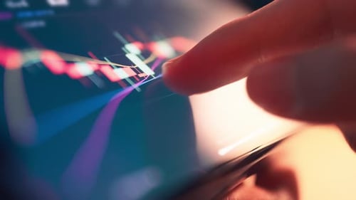 Woman is checking Bitcoin price chart on digital exchange on smartphone