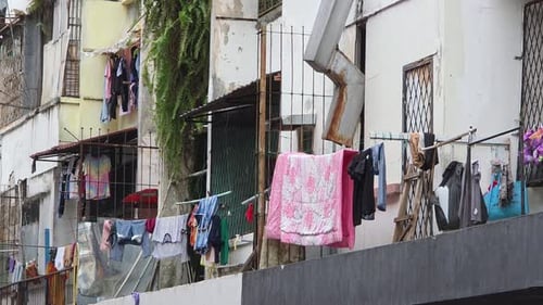 Drying Laundry On Apartment Balcony In Kota Kinabalu, Malaysia. - wide shot
