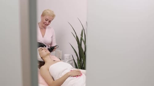 Medical Spa: Woman Receives Facial Treatment