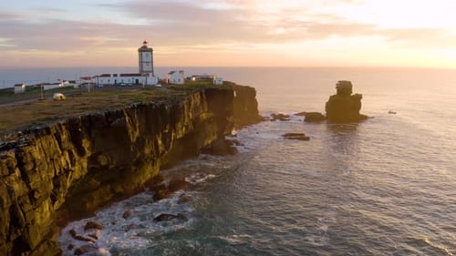 Coastal Lighthouse at Sunset Aerial View